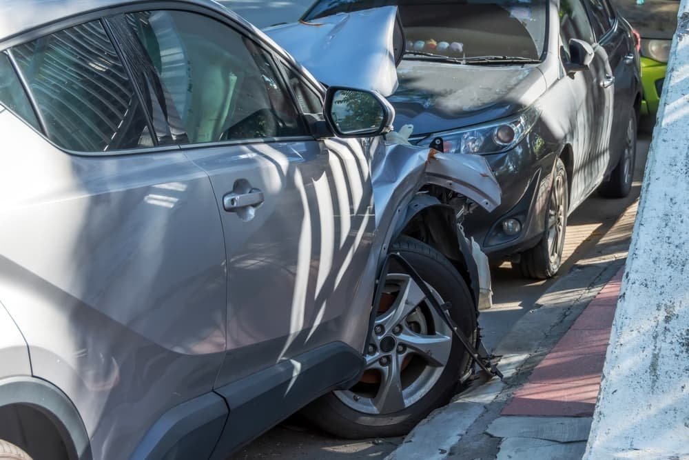 Car crashed into parked car on neighborhood street