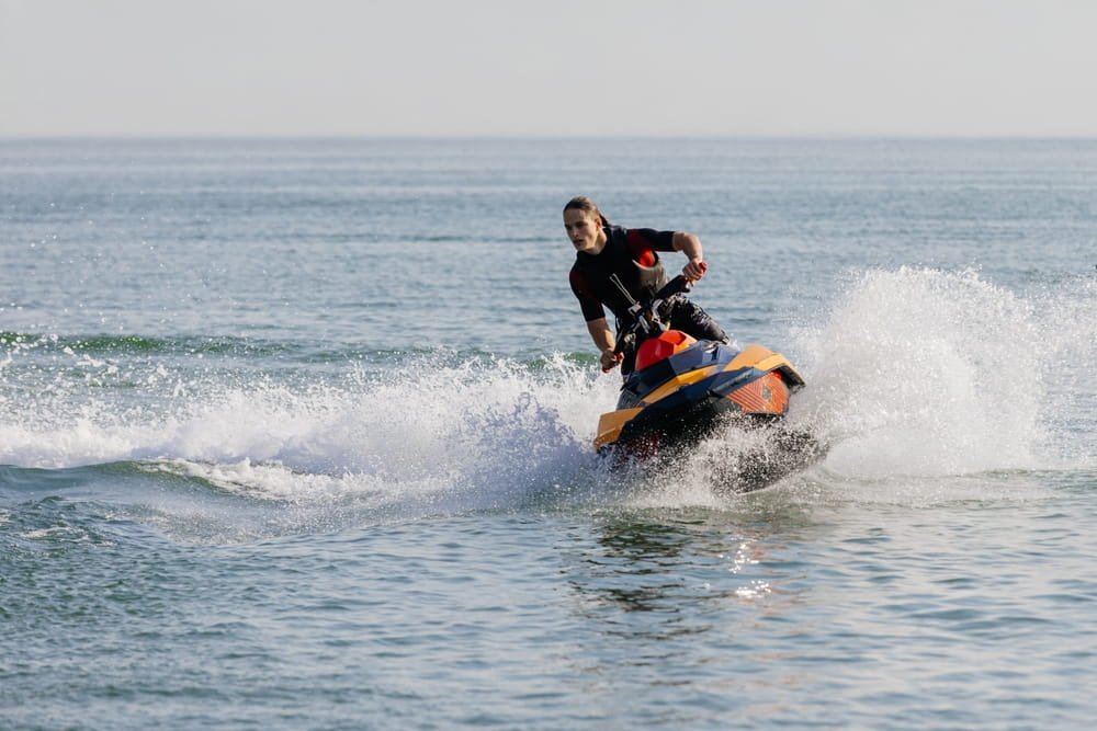 Jet ski losing control in large waves off Fort Lauderdale, Florida illustrating the risk of serious injury and liability in a jet ski accident